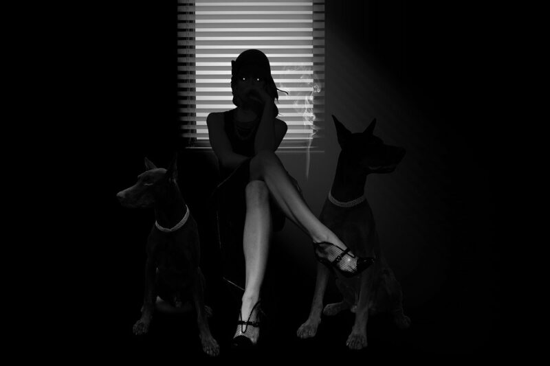 Femme fatale mit schwarzen Hunden