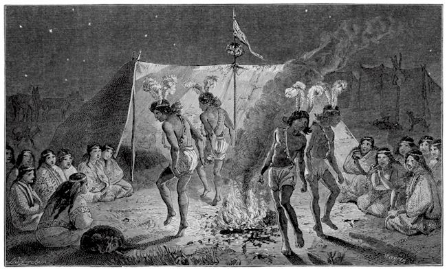 Zeremonie der Tehuelche: 4 Personen tanzen um ein Lagerfeuer, andere sitzen drum herum